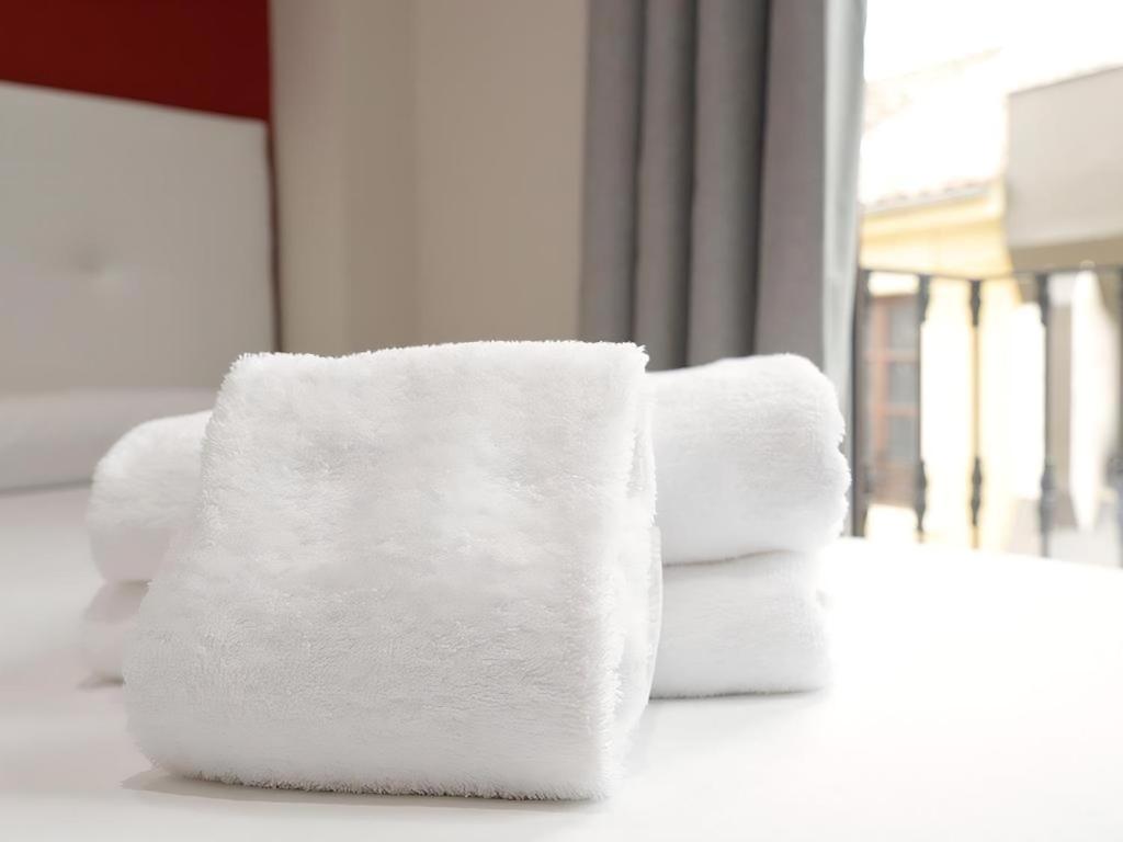 Posteľ alebo postele v izbe v ubytovaní Apartamentos Comfort City