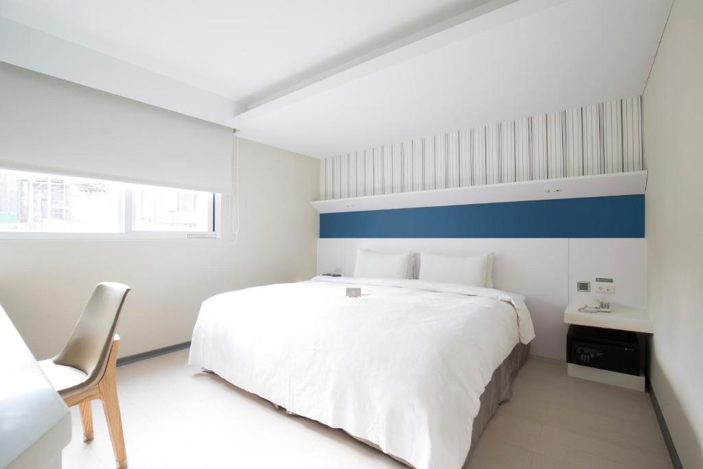 Postel nebo postele na pokoji v ubytování Dandy Hotel - Tianmu Branch