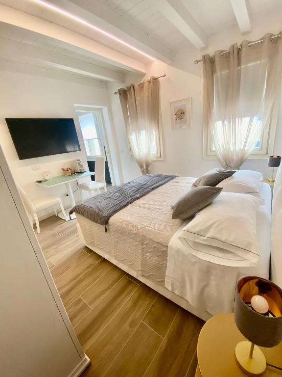 Postel nebo postele na pokoji v ubytování Star Soave Rooms - Locazione Turistica