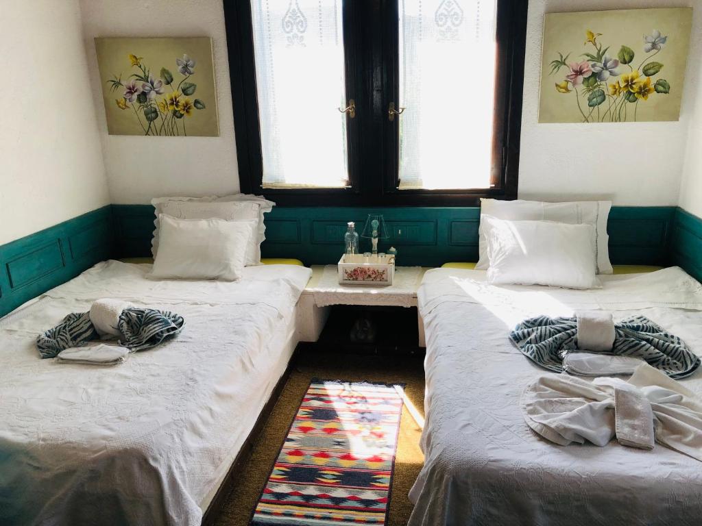 Postel nebo postele na pokoji v ubytování ΤΟ ΑΡΧΟΝΤΙΚΟ