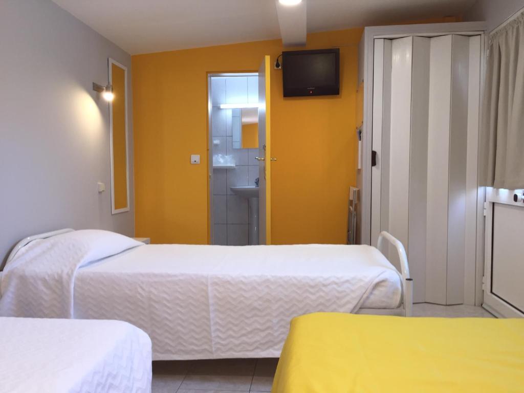 Postel nebo postele na pokoji v ubytování Guest House Sao Filipe
