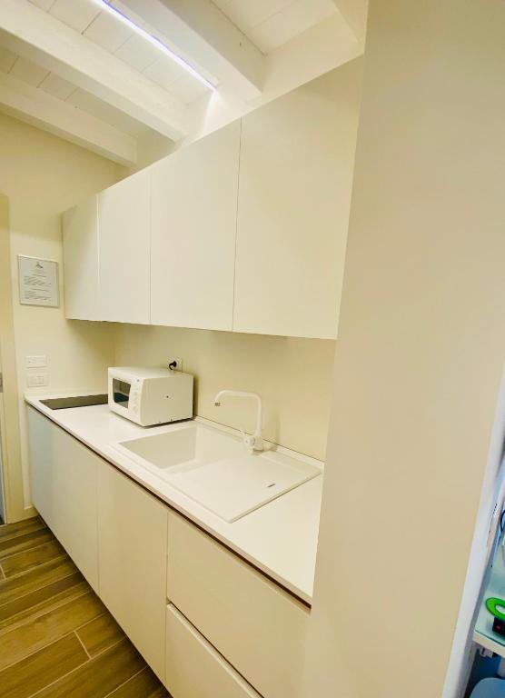 Kuchyň nebo kuchyňský kout v ubytování Star Soave Rooms - Locazione Turistica