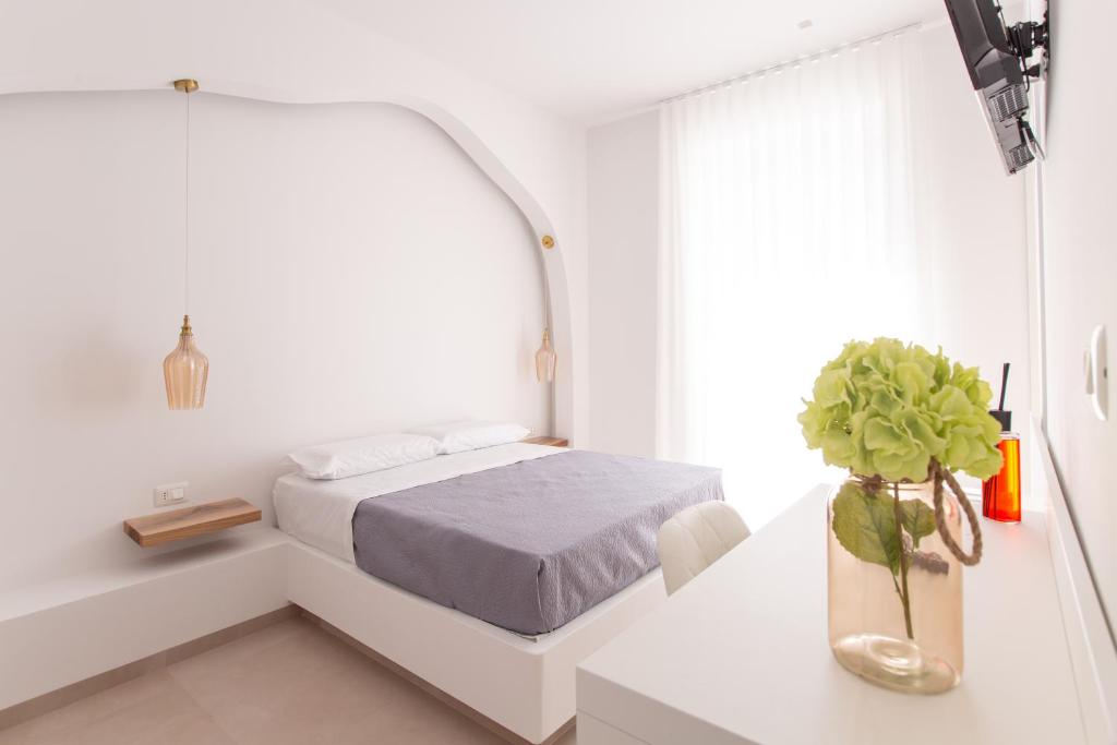 Postel nebo postele na pokoji v ubytování Le Dune Luxury Rooms