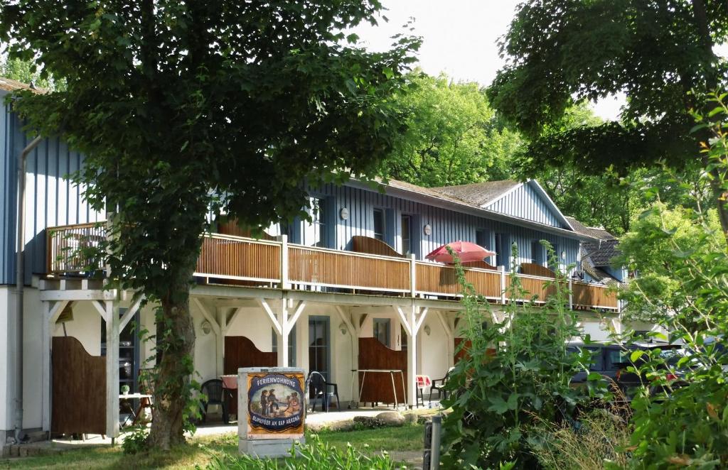 a house with a deck on the side of it at Blinkfüer am Kap Arkona in Putgarten