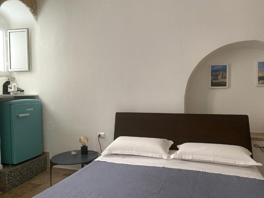 Postel nebo postele na pokoji v ubytování Al Duomo Rooms