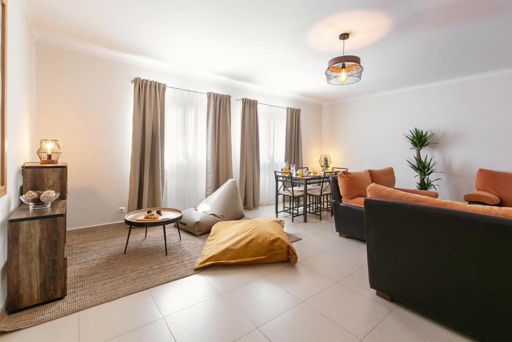 a living room with a couch and a table at Ferrel Apartment in Ferrel