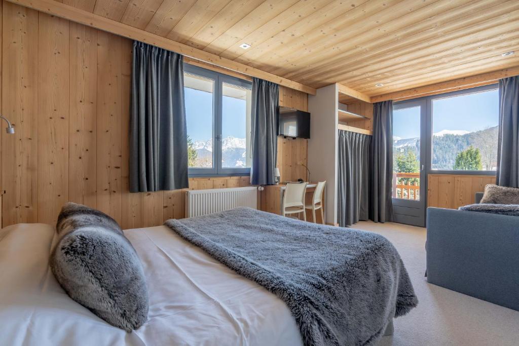 Postel nebo postele na pokoji v ubytování Chalet Les Rhodos