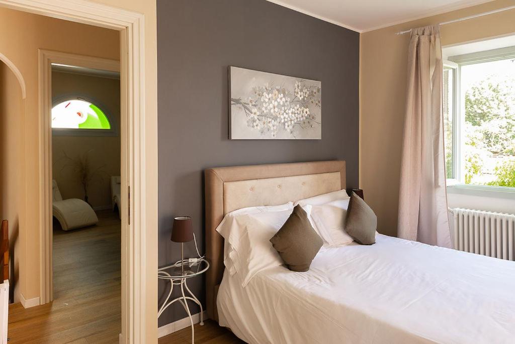 Postel nebo postele na pokoji v ubytování Villa Antica Colonia SPA & Wellness