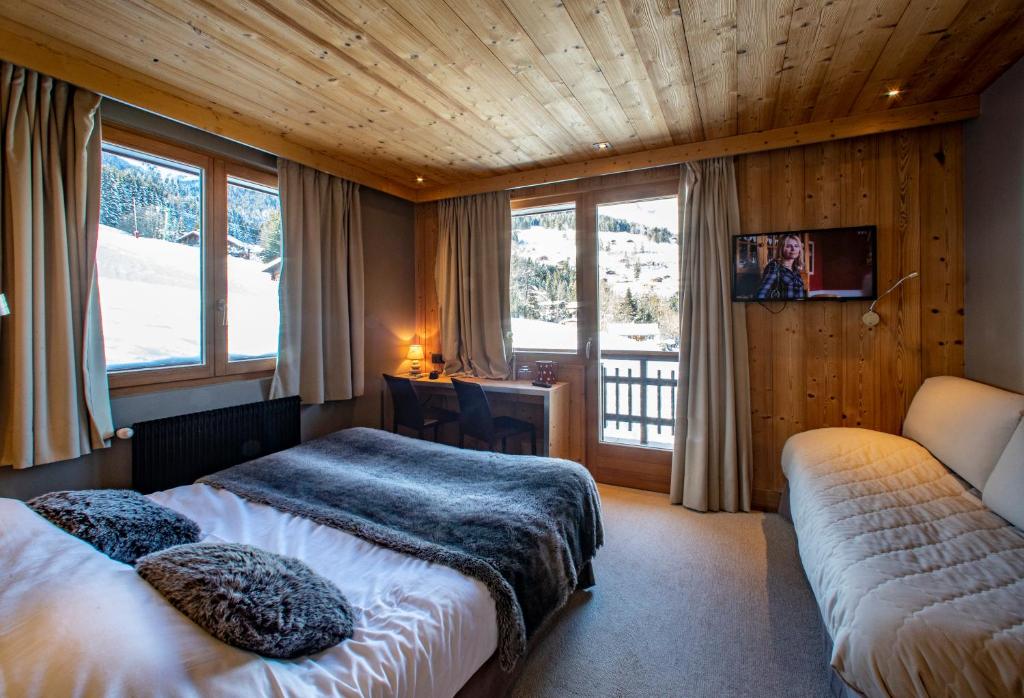 Postel nebo postele na pokoji v ubytování Chalet Les Rhodos
