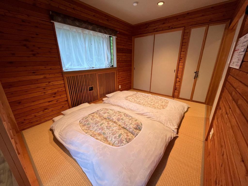 Postel nebo postele na pokoji v ubytování FOREST HOUSE