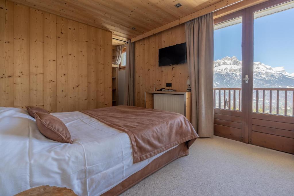 Postel nebo postele na pokoji v ubytování Chalet Les Rhodos