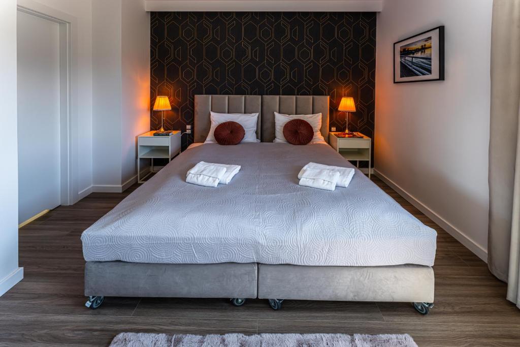 Postel nebo postele na pokoji v ubytování Klif Resort Apartamenty