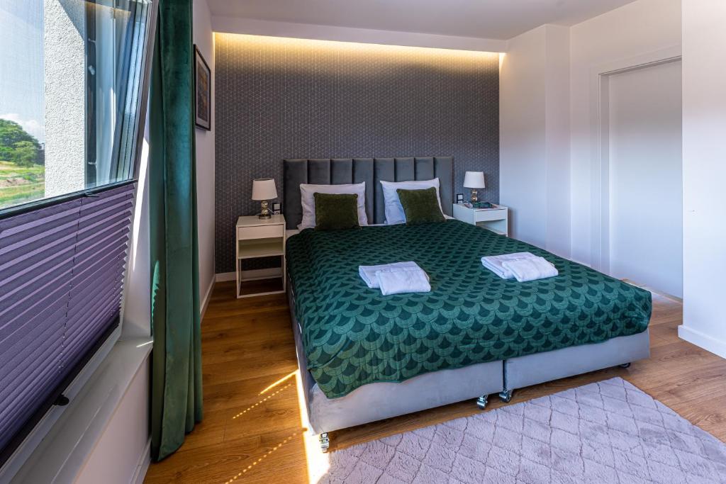 Postel nebo postele na pokoji v ubytování Klif Resort Apartamenty