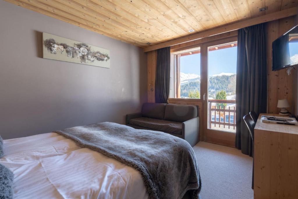Postel nebo postele na pokoji v ubytování Chalet Les Rhodos