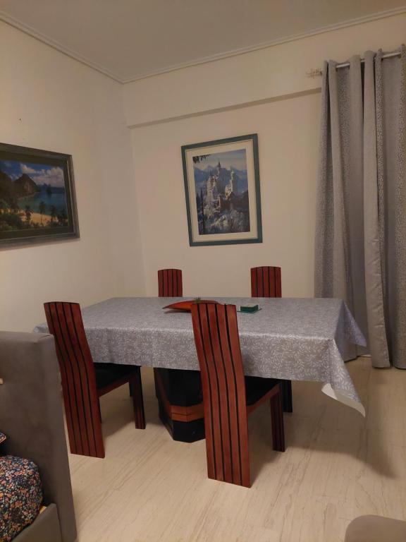 a dining room with a table and two chairs at PlazaVerrosA6Room in Tripoli