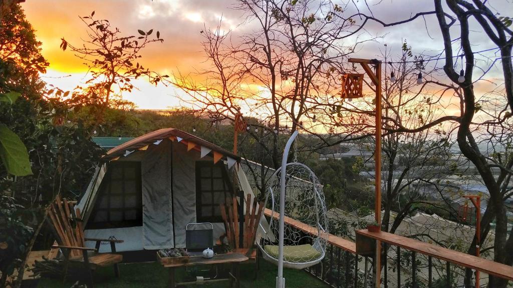 a gazebo with a sunset in the background at Dốc Nhà Tây in Da Lat