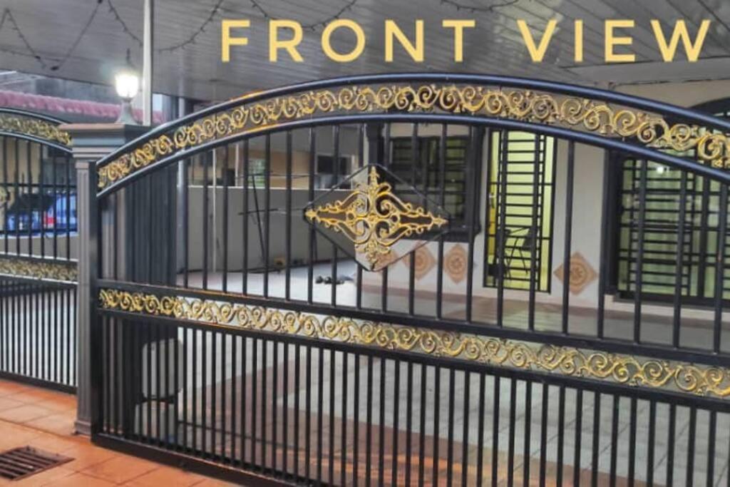a black wrought iron gate with a star on it at Krystal Homestay in Kulim