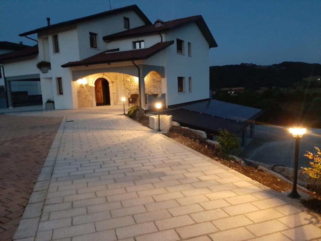 a driveway leading to a house at night at Il Riccio home & relax in Riccia