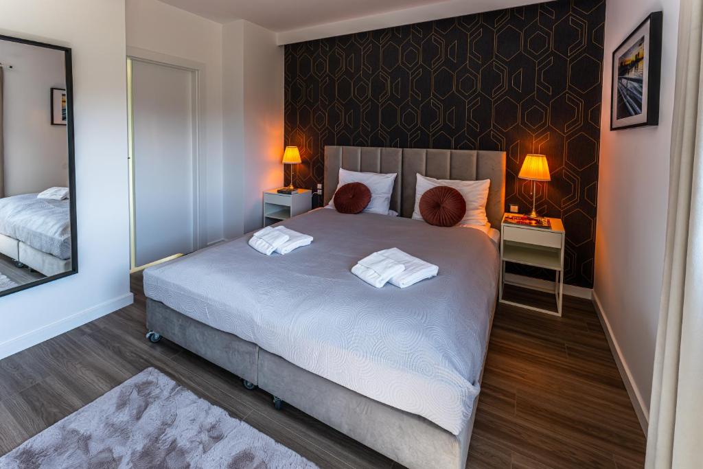 Postel nebo postele na pokoji v ubytování Klif Resort Apartamenty