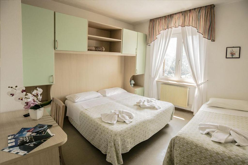 Postel nebo postele na pokoji v ubytování Hotel Aurora