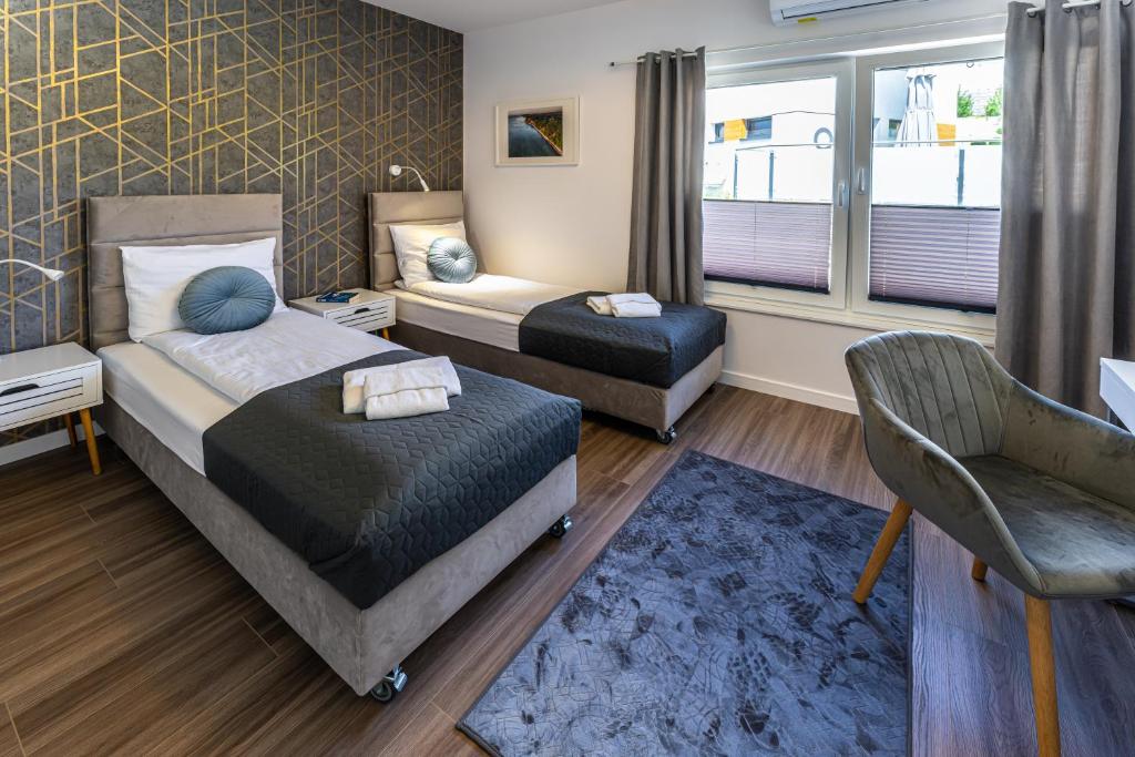 Postel nebo postele na pokoji v ubytování Klif Resort Apartamenty