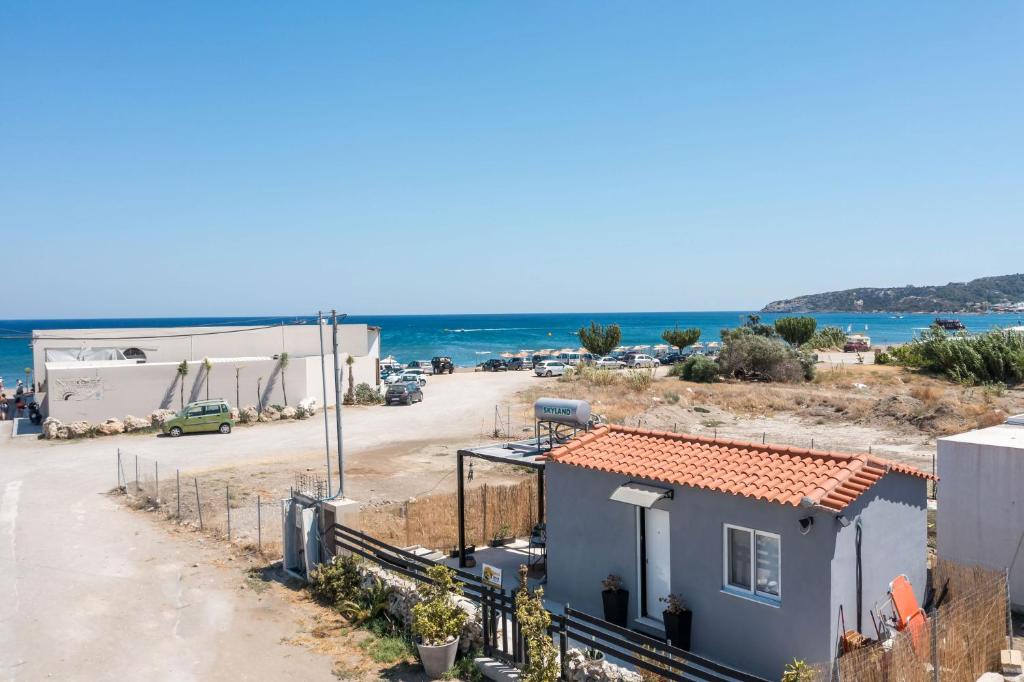 a view of a house and the ocean at Marco Beach Tiny House in Faliraki