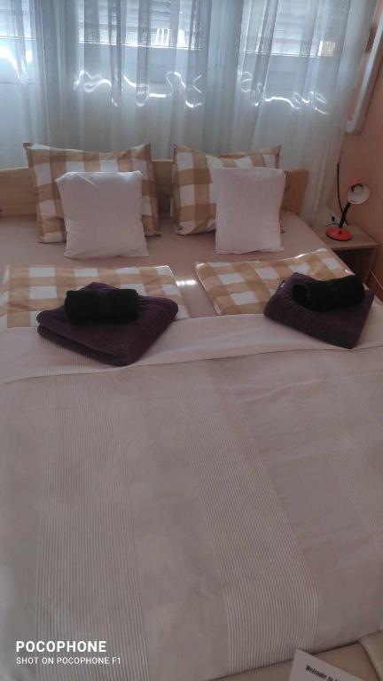 A bed or beds in a room at 100 lépés - 100 steps - Apt with huge terrace next to the thermal bath