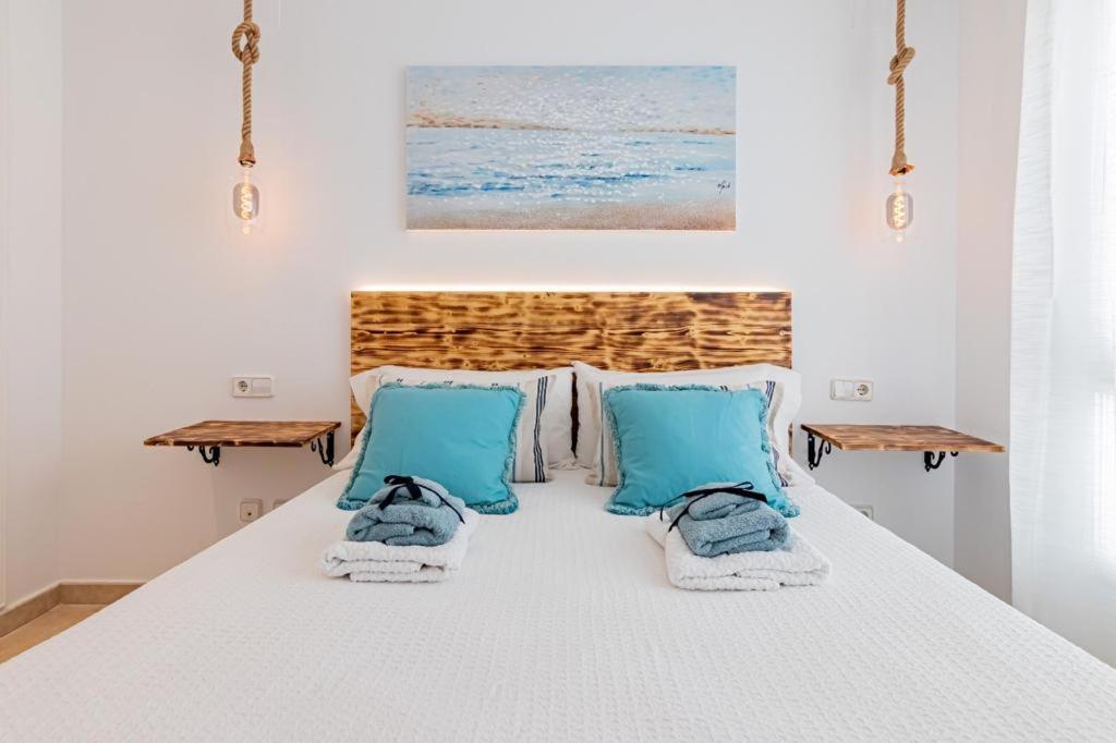 Ένα ή περισσότερα κρεβάτια σε δωμάτιο στο María Turquesa by Altea Blanca Apartamentos Turísticos