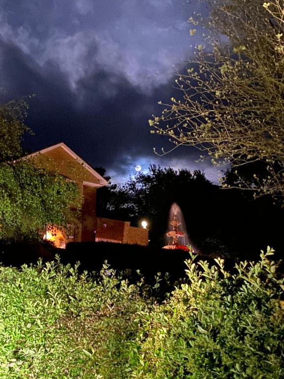 a night view of a house with a dark sky at Winterwood in Listowel