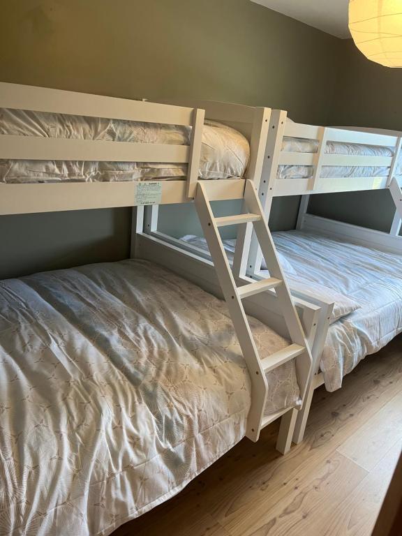Postel nebo postele na pokoji v ubytování Cúlú