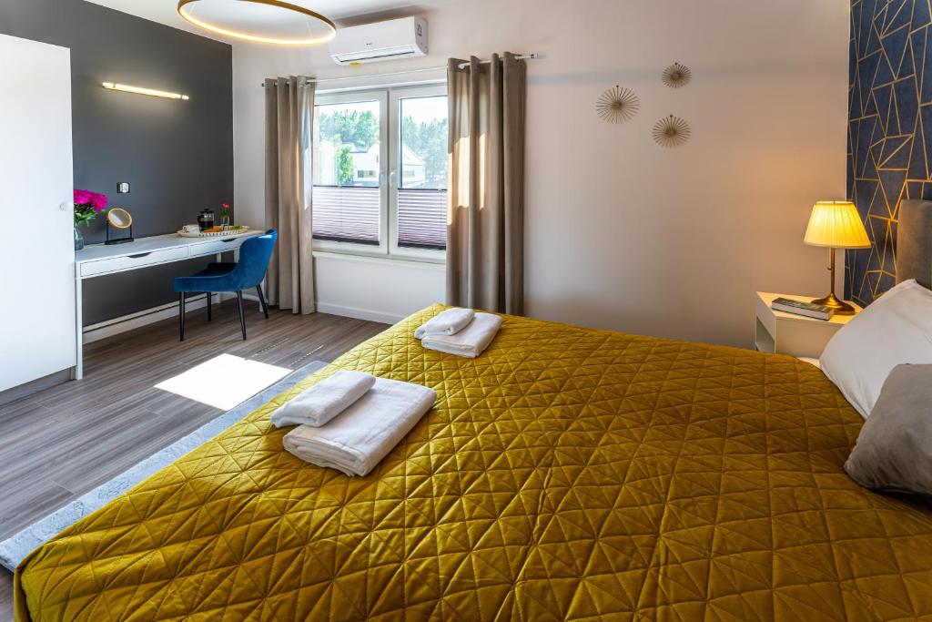 Postel nebo postele na pokoji v ubytování Klif Resort Apartamenty