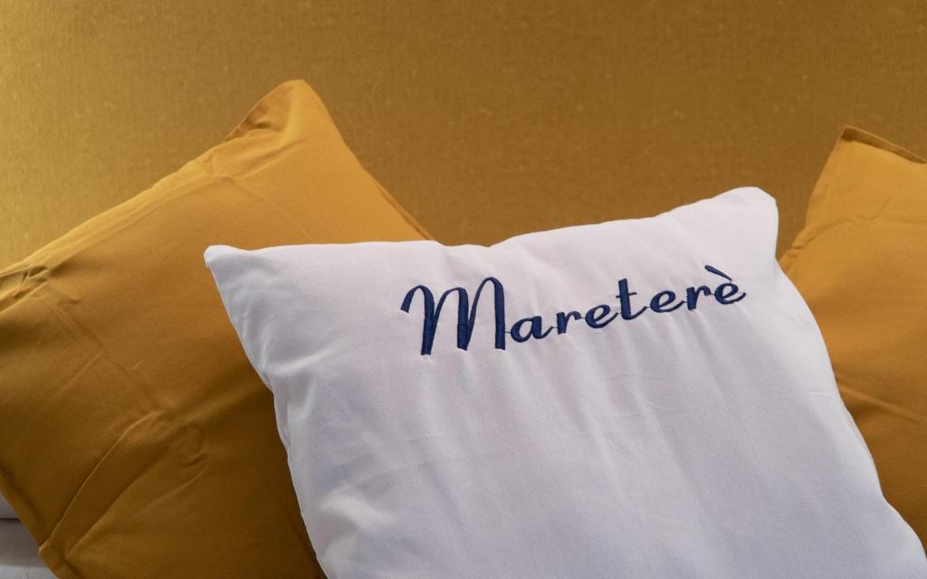 a white pillow with the word marauder written on it at Mareterè in Vietri sul Mare
