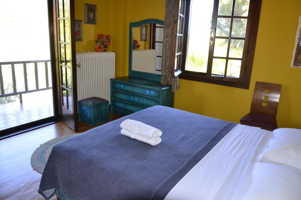 A bed or beds in a room at Monica's Tropical Villa
