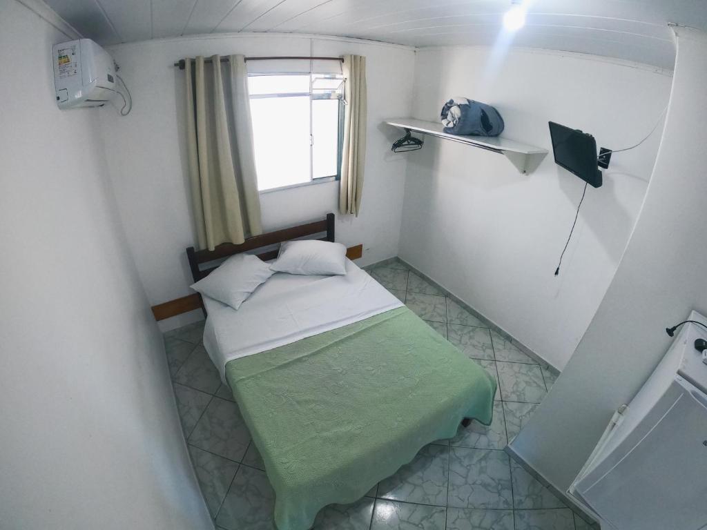Postel nebo postele na pokoji v ubytování HOTEL MORADA DO SOL