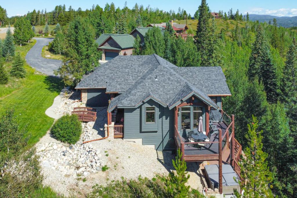 an aerial view of a house with a porch at Hilltop Palace in Fraser