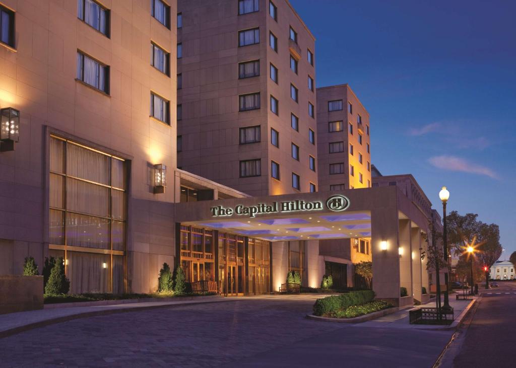 a hotel building with a sign that reads the capital function at Capital Hilton in Washington, D.C.