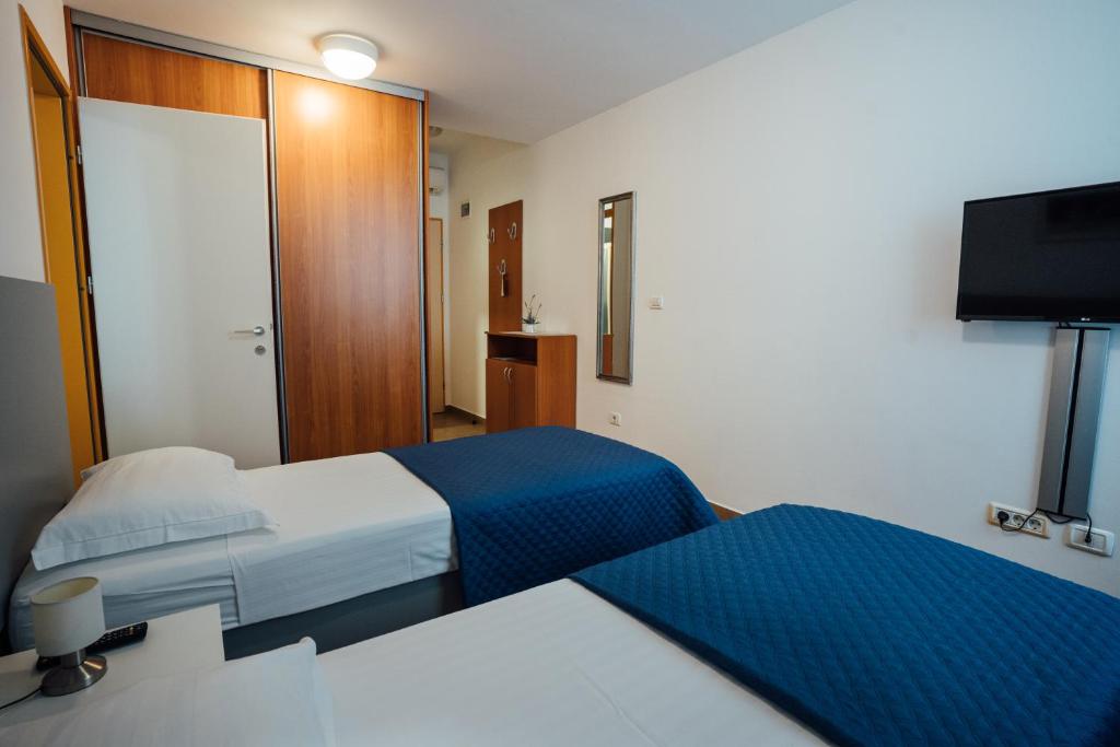 Postel nebo postele na pokoji v ubytování Sobe Rooms Nataly