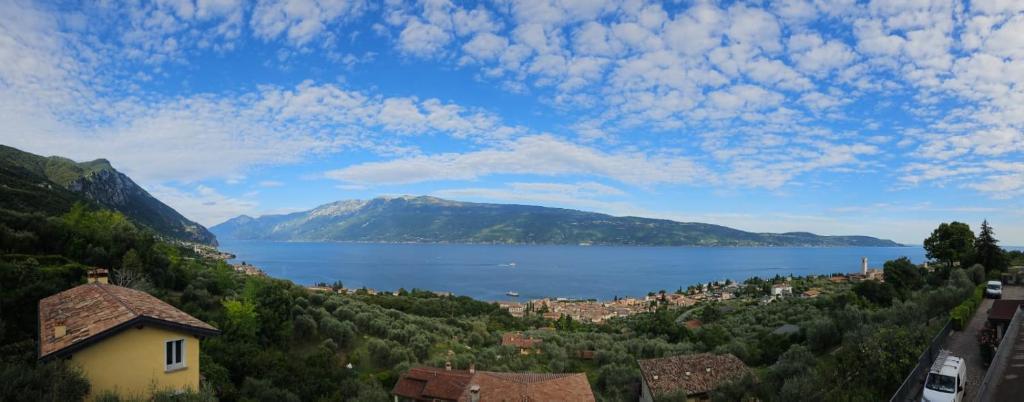 a view of a town and a lake with mountains at CRISTOL 12 in Gargnano