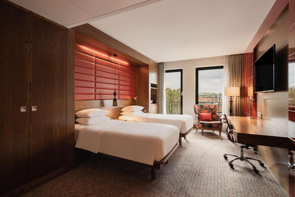 Postel nebo postele na pokoji v ubytování Hilton The Hague