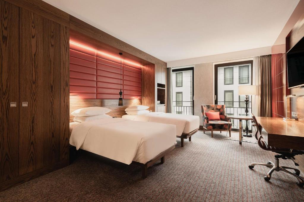 Postel nebo postele na pokoji v ubytování Hilton The Hague