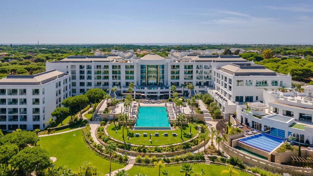 an aerial view of a large building with a pool at Conrad Algarve in Quinta do Lago