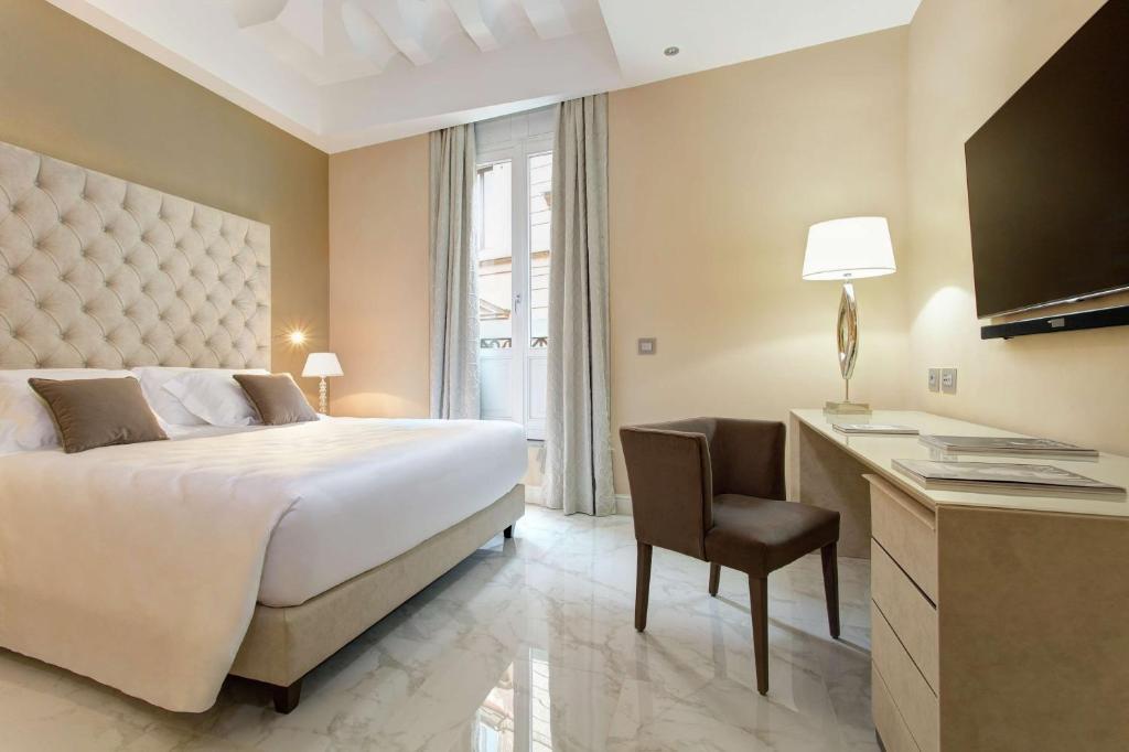 Postel nebo postele na pokoji v ubytování Aleph Rome Hotel, Curio Collection By Hilton