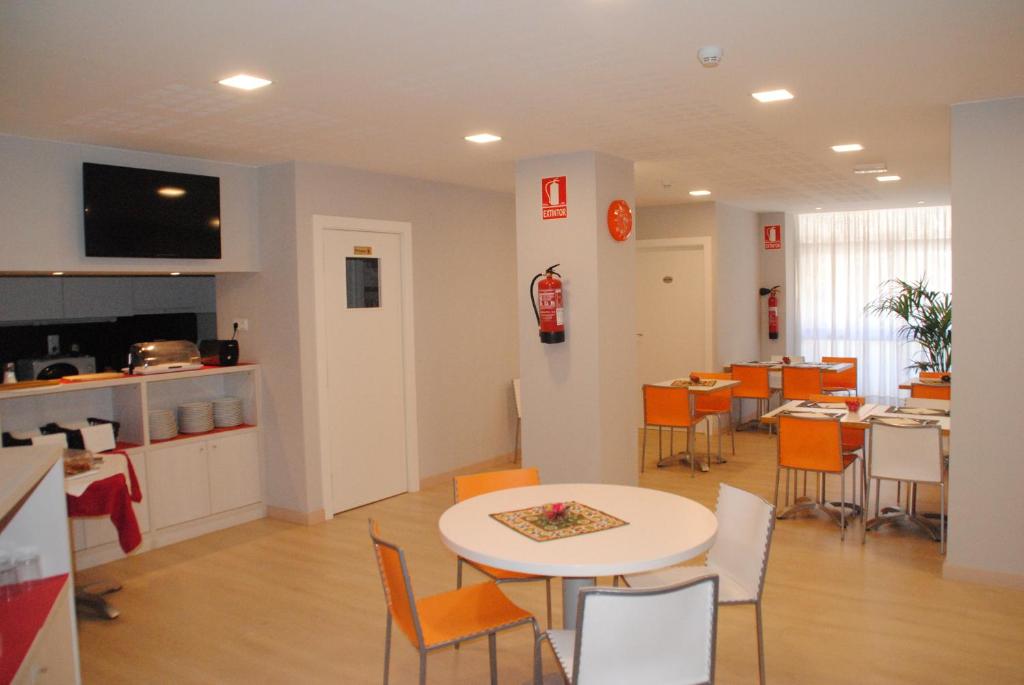 TV a/nebo společenská místnost v ubytování Hostal Aslyp 114