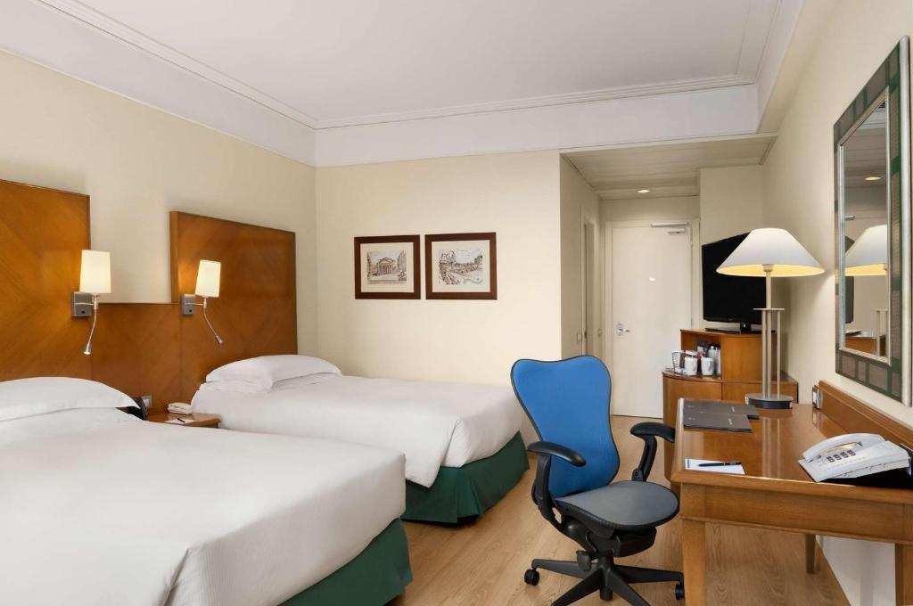 Postel nebo postele na pokoji v ubytování Hilton Rome Airport