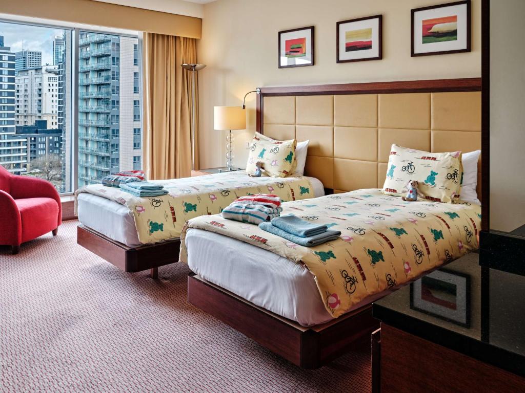 Posteľ alebo postele v izbe v ubytovaní Hilton Warsaw City Hotel