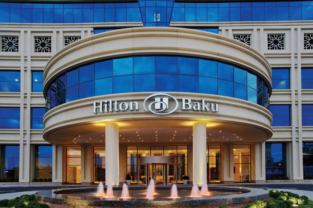 a building with a hilton balashi sign in front of it at Hilton Baku in Baku
