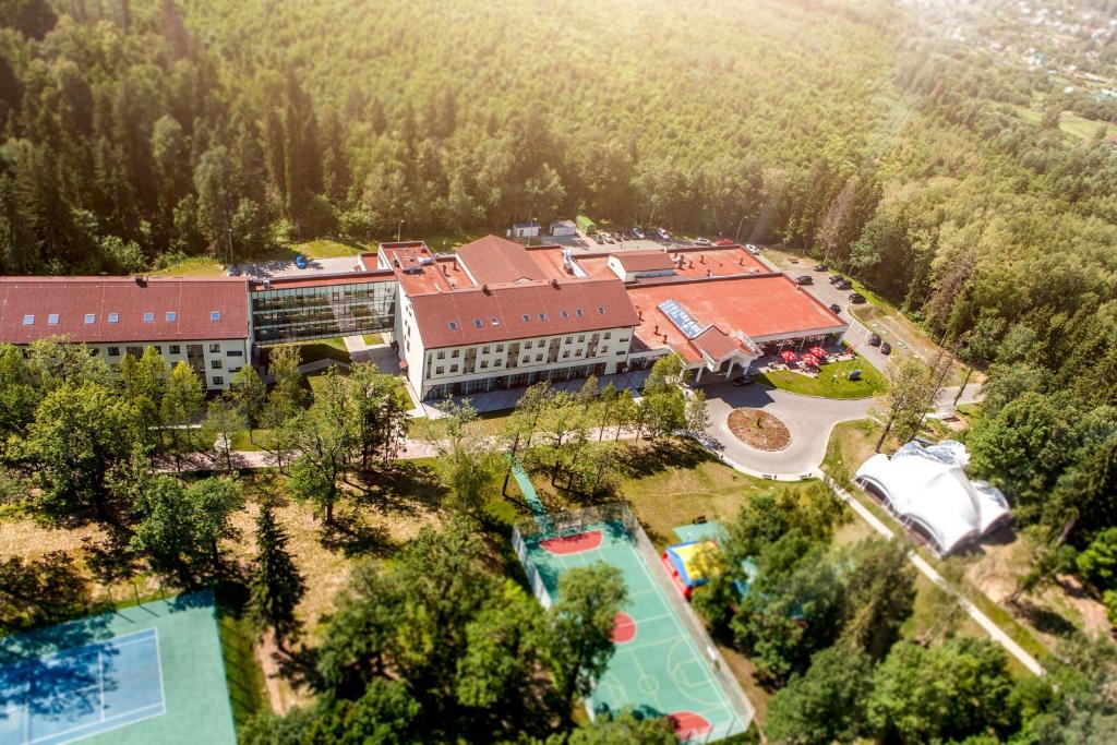 an aerial view of a resort with a swimming pool at Hilton Garden Inn Moscow New Riga in Istra