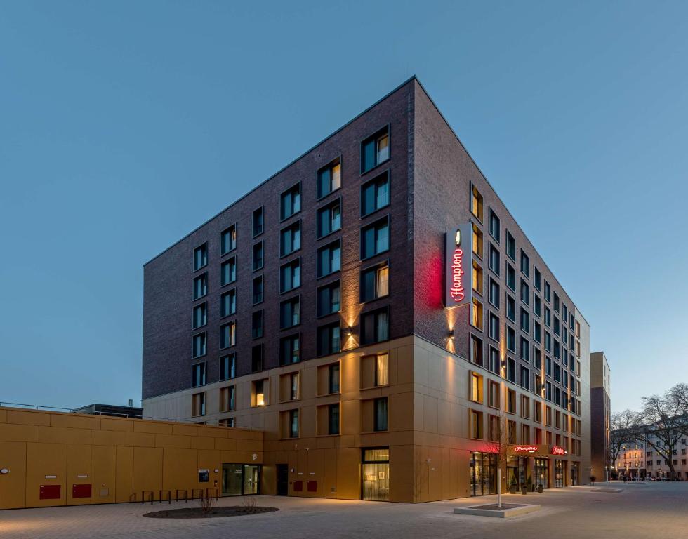 a building with a sign on the side of it at Hampton by Hilton Düsseldorf City Centre in Düsseldorf