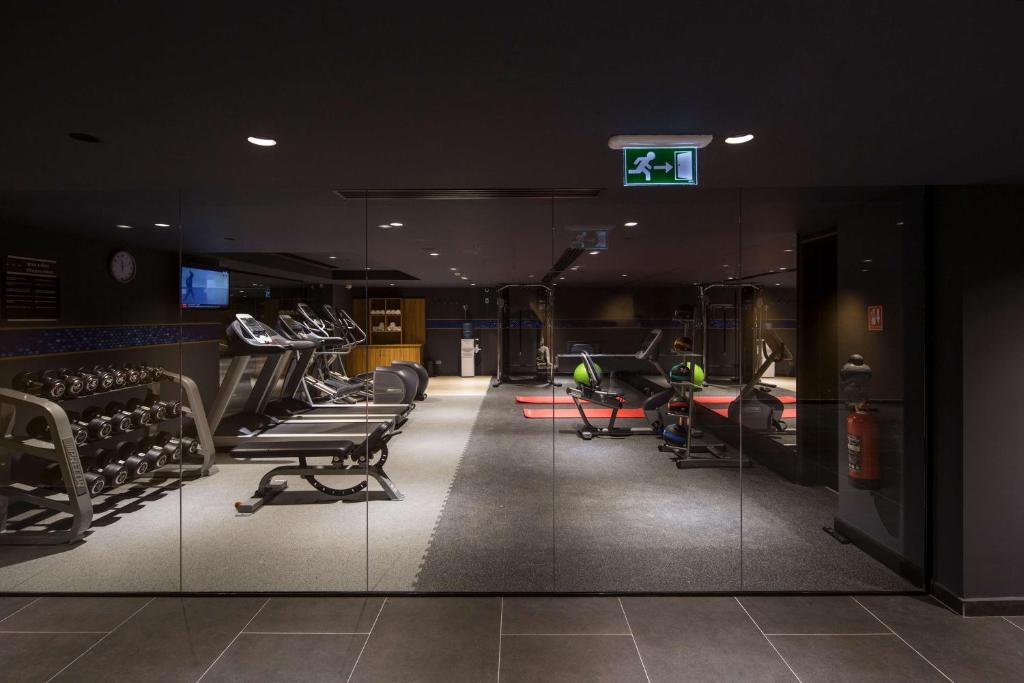 a gym with chairs and a sign on the wall at Hampton by Hilton Istanbul Kurtkoy in Istanbul