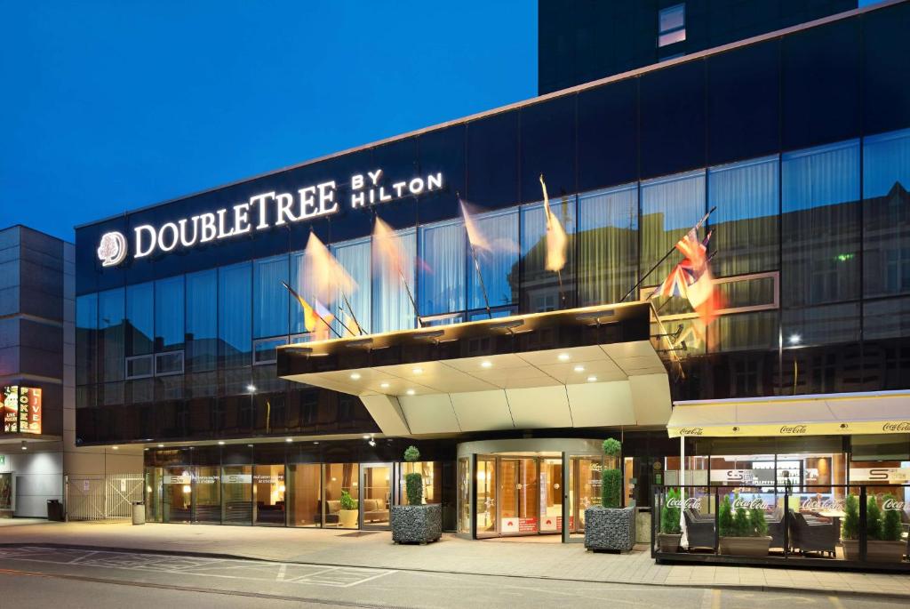 a building with a sign on the side of it at DoubleTree By Hilton Košice in Košice